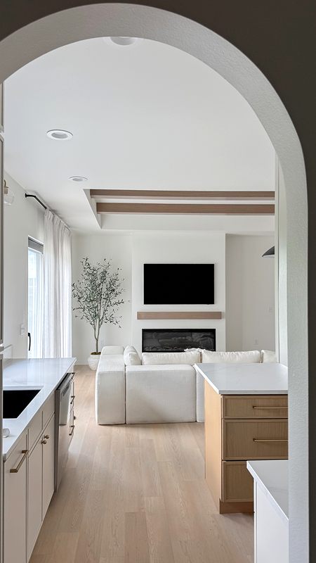 Arched doorway looking into a bright living room