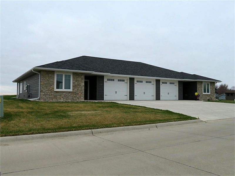 Stone-front ranch home with a multi-stall garage